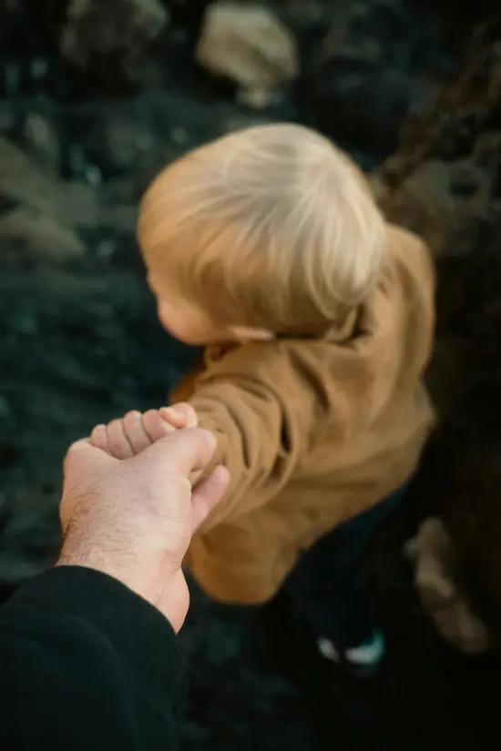 holding a kids hand